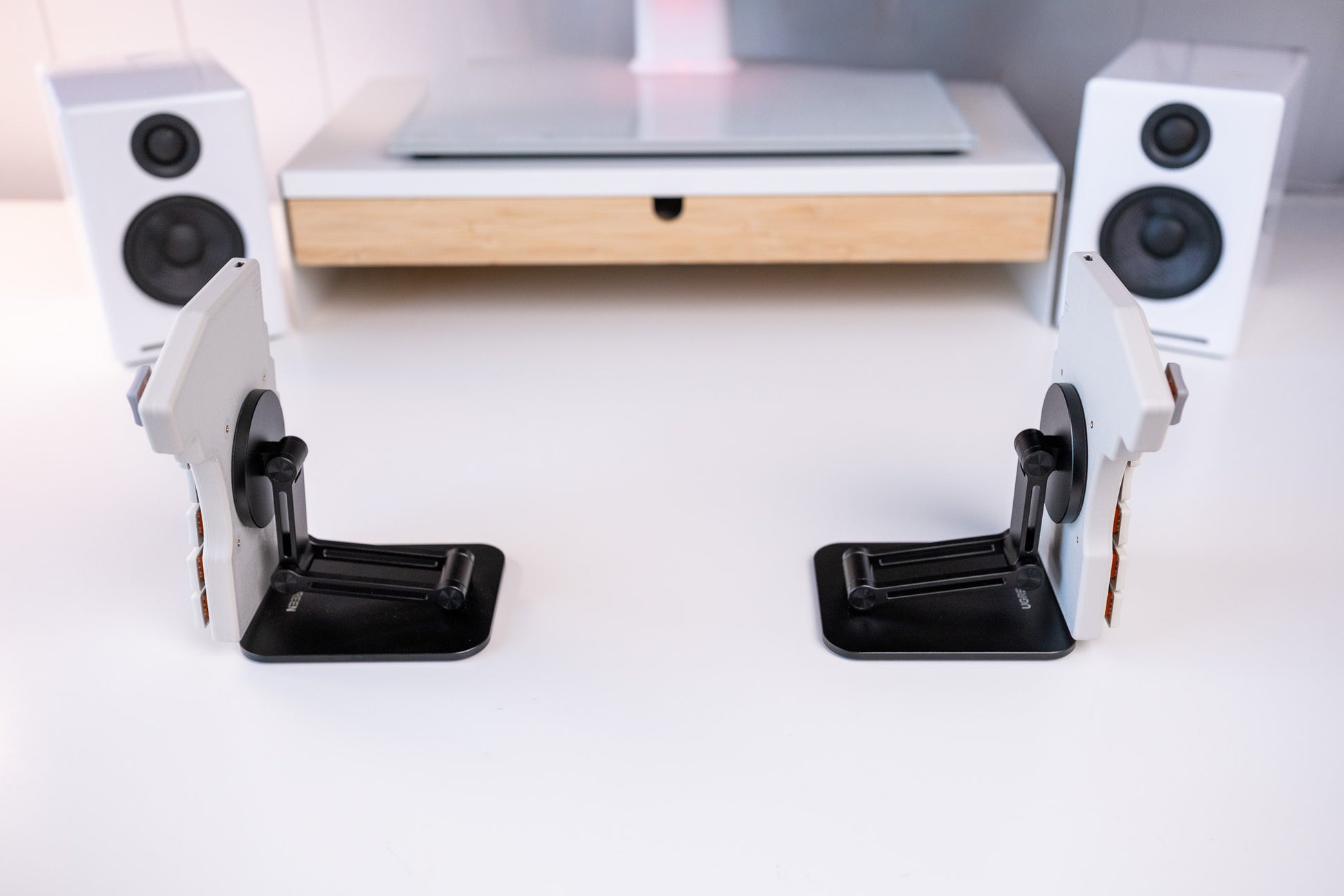 Mantaray Pro Wireless on two tenting stands angled vertically on a desk.