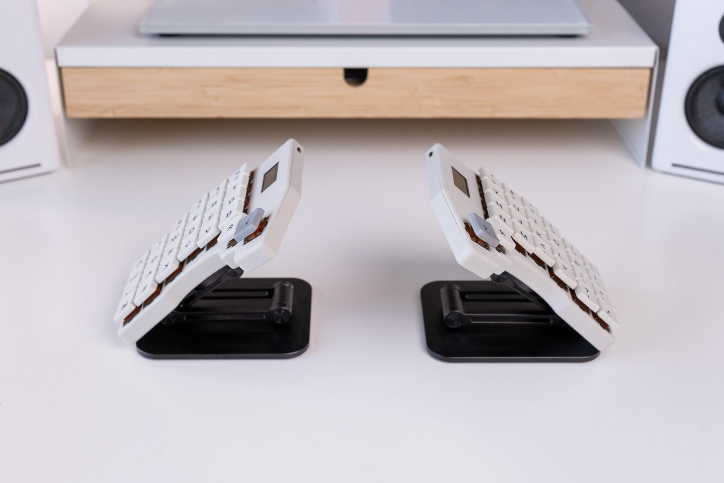 Mantaray Pro Wireless on two tenting stands angled upward on a desk.
